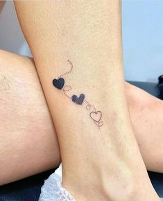 two people with matching tattoos on their legs