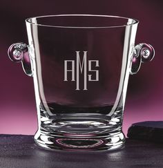 a glass with the initials amg on it