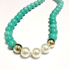 This turquoise and pearl necklace created by Jewelry By Carmal is made of smooth round turquoise howlite gemstones, white fresh water pearls, sterling silver: beads, lobster claw clasp and findings. This necklace measures 19 1/2 inches in length. View more beaded necklaces: http://www.etsy.com/shop/jewelrybycarmal?section_id=7999556 All of our jewelry arrives wrapped and ready for gift giving. We offer free standard shipping, via USPS, within the United States. Please see other items in our shop Elegant Turquoise Beads With Natural Stones, Adjustable Turquoise Single Strand Pearl Necklace, Handmade Turquoise Pearl Necklace, Elegant Turquoise Jewelry With 8mm Beads, Beaded Howlite Turquoise Necklace With Round Beads, Adjustable Turquoise Pearl Necklace With Round Beads, Turquoise Howlite Necklace With Round Gemstone Beads, Turquoise Pearl Necklace With Natural Stones, Elegant Turquoise Necklace With 8mm Beads