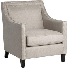 an upholstered chair with studding on the arms