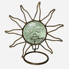 a glass sun with an evil face on it