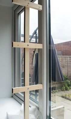 a window sill with some clothes hanging on it