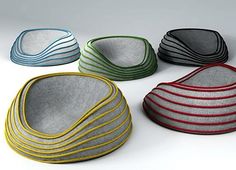 several bowls with different colors and sizes are shown in this image, one is empty