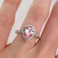 Elegant Vintage Inspired Pink Sapphire Ring ►Made of solid sterling silver with rhodium finish (925) ►Accented With Simulated Diamonds (CZ) ►Average band width: 2 mm Center Stone: Sapphire Color: Pink Shape: Teardrop Gem size: 7.0 x 10.0 mm Carat Weight: 2 ct. (approx.) Gemstone creation: 100% Natural Hardness: 9-9.5 (Mohs scale)- tests like a natural diamond ►Due to the gemstone nature, color of the gem may slightly vary. ✓ 100% Nickel-Free ✓ Hypoallergenic ✓ Comfort Fit ✓ Free Ring Box ✓ Free Popular Engagement Rings, Mohs Scale, Pink Sapphire Ring, Sapphire Color, Birthstone Gifts, Creating Jewelry, Wedding Ring Designs, September Birthstone, Sapphire Engagement