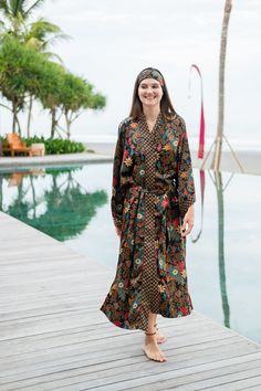 The perfect gift for anyone who loves the finer moments in life, this soft and sexy kimono robe is crafted by hand with strong attention to detail. With a gorgeous print and exclusive stitches, it's perfect for an extended variety of use. Elevate your kimono experience with the luxurious touch of our blended silk viscose fabric. This exquisite material harmoniously combines the elegance of silk with the comfort of viscose, resulting in a fabric that drapes effortlessly and exudes a subtle sheen. Beachwear Kimono With Kimono Sleeves For Daywear, Daywear Kimono With Kimono Sleeves For Beach, Beachwear Kimono For Daywear, Long Printed Robe For Loungewear, Printed Long Sleeve Kimono For Loungewear, Floral Print Long Sleeve Sleep Kimono, Printed Kimono For Beachwear And Loungewear, Printed Kimono For Loungewear And Beachwear, Long Printed Kimono For Loungewear