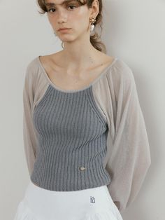 This knit top can be worn any time of the year.Cozy and classic, it is easy-going and fresh.This easy layer is perfect for everywhere. - Round neck and regular fit knit top- Made from soft fabric for a sophisticated look- It's perfect for daily wear- Front metal brand logo- Cropped length and ribbed hem - This one features a mixed fabric Chic Soft Knit Tops For Loungewear, Knit Tops For Layering In Winter, Versatile Fine Knit Winter Tops, Versatile Fine Knit Tops For Layering, Versatile Winter Fine Knit Tops, Cozy Stretch Tops For Layering, Knit Tops With Ribbed Neckline For Layering, Cozy Soft Knit Tops For Layering, Fine Knit Tops For Spring Layering