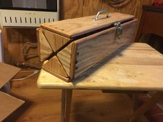 a wooden box sitting on top of a table