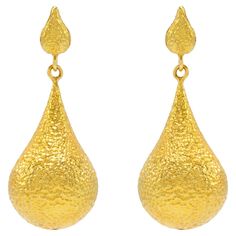 The Bali 20k Gold hand hammered, one of a kind earrings are like wearing royalty! The luxurious color of the gold complimented with the perfect amount of hammering is ideal for day or night. The vibe here is make a wish and watch the magic happen. Spectacular to elevate your style day or night! Unparelleled luxury! The Essentials Collection is the ultimate in ease and beauty. Effortlessly transitions from day to night. These are the foundational pieces that all other collections were born. 20k gold, hand made and textured with a gorgeous hand hammered finish. Deliberately made to add on and pair with all Tagili collections. These are the staple pieces for an easy going vibe yet highly glamorous style. The Tagili Promise: With every purchase a portion of the proceeds goes to a local woman's Luxury 22k Gold Earrings For Formal Occasions, Luxury Hammered Drop Earrings, Luxury Hammered Gold Earrings, Luxury Hammered Earrings For Anniversary, Hammered Teardrop Earrings For Formal Occasions, Formal Teardrop Hammered Jewelry, Gold Hand Forged Drop Earrings, 22k Yellow Gold Hammered Earrings, Hand Forged Gold Drop Earrings