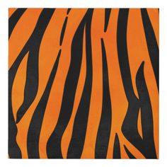 an orange and black rug with zebra stripes