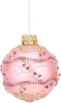 a pink ornament hanging from a string with gold trimmings on it