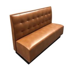 a brown leather couch sitting on top of a white floor