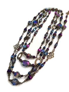 Absolutely stunning exotic and sophisticated OOAK vintage style set of four multi-color extra long layering necklaces set in peacock blue and purple that you could pair and layer for a trendy statement look. The sparkle and shimmer will be the head turners day or night and complimented each time you wear them. These statement beaded necklaces are created with large exotic Asian glass crystal beads in blue and purple, bright blue and grey undertones, large, faceted, and European vintage plated gl Extra Long Necklace, Necklaces Set, Layering Necklaces, Crystal Bead Necklace, Layered Necklace Set, Long Necklaces, Purple Pearl, Beaded Statement Necklace, European Vintage