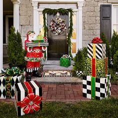 christmas presents are wrapped in black and white checkered wrapping on the front lawn of a house