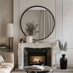 a living room with a fire place in the center and a mirror on the wall