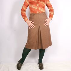 "Vintage Italian 70s Pure New Wool plaid front pleat skirt in beige S/M, Academia smart casual skirt 30s 40s style - A-shaped secretary, business, work, office, smart casual skirt - Similar to 30s and 40s style - Medium weight fabric, lined - Zip closure - High-waisted - Brand: Variable Firenze - 100% pure new wool, lining estimated viscose - Excellent mint vintage condition - Tag size I46, estimated S/M, please see exact measurements MORE vintage SKIRTS in my shop: https://www.etsy.com/shop/GoodGrooves?ref=simple-shop-header-name&listing_id=1308389865§ion_id=39276826 ✿ MEASUREMENTS (taken flat) ✿ 27.5\" / 70  cm length 15.5'' / 39.5 cm waist I have M in the waist (30''/ 76 cm) and L in the hips (41.5'' / 106 cm) - it was a slightly small fit. My height - 5'7 / 170cm. This is true vintage, Smart Casual Skirt, 40s Mode, 40s Style, Office Skirt, Pleat Skirt, Vintage Skirts, 40s Fashion, Business Work, Vintage Rock