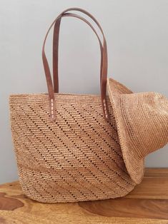 Crochet tote basket, summer basket, raffia crochet bag, crochet straw bag, beach bag, beach basket Large Crochet Raffia Bag -Composition: 100% natural raffia from Madagascar -Handle: 100% Leather -Lining: 100% Cotton -Dimensions: 36cm×48cm The bag closes with a zipper Interior lined in cotton canvas with one patch pocket. Magnificent bag entirely handmade. A tote bag, a bag that easily matches any outfit. Due to handwork and the nature of raffia, there may be slight differences in measurement or Chic Crochet Bag With Open Weave For Beach Season, Chic Open Weave Crochet Bag For Beach, Chic Open Weave Crochet Bag For Beach Season, Chic Crochet Bag With Open Weave, Brown Straw Crochet Bucket Bag, Large Capacity Basket Crochet Bag For Summer, Brown Crochet Straw Bucket Bag, Large Capacity Crochet Bucket Bag For Summer, Large Capacity Crochet Basket Bag For Summer