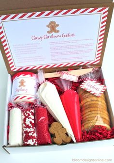 a box filled with cookies and candy canes in red and white paper wrappers