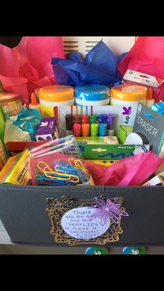 a large box filled with lots of different types of crafts and crafting supplies on top of a table