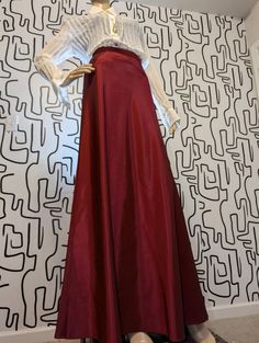 Glide through any occasion with effortless elegance in this floor-length maroon satin skirt. The rich, deep hue and luxurious sheen create a flowing silhouette that catches that light with every step. Perfect for making a dramatic entrance, this skirt is your go-to for channeling vintage romance with a modern, sultry edge. Styling Services, Dramatic Entrance, Don't Know What To Wear, Vintage Romance, Effortless Elegance, Satin Skirt, Floor Length, What To Wear, Entrance