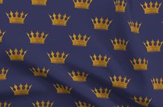 a blue background with gold crowns on it