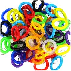 a bunch of different colored hair ties on top of each other in the shape of letters