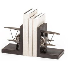 two bookends made out of wood and metal with wheels on each one side