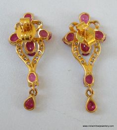 "14k GOLD EARRINGS EAR STUD FROM RAJASTHAN INDIA, GREAT HANDMADE DESIGN MADE OF 14K YELLOW GOLD SATED REAL A QUALITY RUBY & DIAMOND GEM STONES, NICE PIECE GOOD FOR JEWELRY COLLECTION. Height max. - 2.8 cm(1.1\") width max. - 1.2 cm(0.47\") Total weight - 3 grams Material - 14 carat solid yellow gold & real gem stones." Yellow Gold Ruby Earrings Hallmarked, Ruby Earrings For Anniversary And Festive Occasions, Festive Ruby Earrings For Anniversary, Gold Ruby Earrings For Diwali, Temple Jewelry Style Ruby Earrings In Yellow Gold, Gold Ruby Earrings Hand Set, Gold Ruby Earrings With 17 Jewels, Yellow Gold Ruby Temple Jewelry Earrings, Traditional 17 Jewel Diamond Earrings For Gift