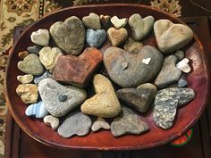 a bowl filled with rocks on top of a table