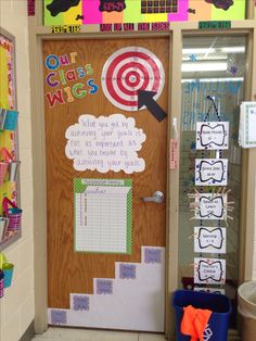 a classroom door decorated with pictures and writing on the front, along with other decorations