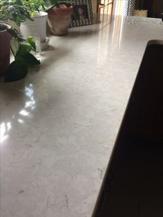 the kitchen counter is clean and ready to be used as a dining room or office