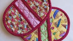 three pieces of quilted fabric on top of each other with different designs and colors