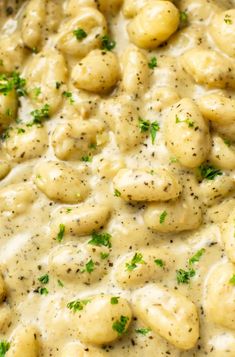 a close up view of some food in a pan with gravy on it