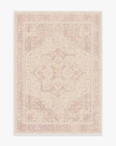 a beige rug with an intricate design on it