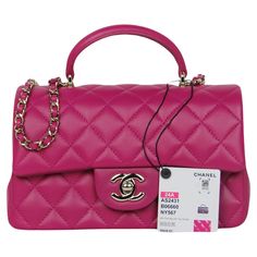 Chanel NWT '24 Pink Lambskin Quilted Mini Top Handle Rectangular Flap Made In: Italy Year of Production: 2024 Color: Pink Hardware: Pale goldtone Materials: Lambskin leather Lining: Leather Closure/Opening: Flap top with CC twist lock Exterior Pockets: Back patch pocket Interior Pockets: One zip and one flat Exterior Condition: Like new, tag still attached Interior Condition: Like new Includes: Dustbag, tag Measurements: 7.5"L x 5"H x 2.5"D Handle Drop: 2" Strap Drop: 22" Flat Exterior, Chanel Print, Vintage Chanel Bag, Chanel Suit, 2024 Color, Mini Top, Navy Leather, Fuchsia Pink, Vintage Chanel