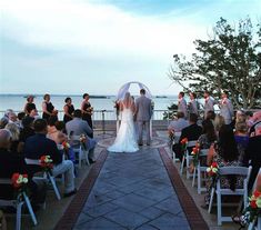 a bride and groom standing at the end of their wedding ceremony