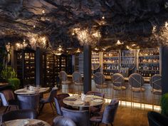 an empty restaurant with many tables and chairs