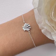 "Spiritually, seashells are often associated with life cycles, divine energy, protection and bring good lick. This shell bracelet is made from high quality 925 sterling silver. It makes a perfect gift for any ocean lover, beach lover or any special occasion. Metal : 925 Sterling Silver. ( 925 stamped ) Length : 6\" + 1\" of extension chain. This dainty bracelet is handcrafted from 925 sterling silver, that will not tarnish your wrist, hypoallergenic, nickel, lead free and waterproof. PACKING: All jewelry is package already to be gifted. Just let me know if the gift is for a birthday, I will add some fun birthday confetti! Also you have the opportunity to add a personal message with no extra cost. Free and ready to ship from our studio in Grant, Florida. Designed with love. LET'S GET SOCIAL Bracelet Ocean, Seashell Bracelet, Energy Protection, Ocean Inspired Jewelry, Beachy Jewelry, Beach Bracelet, Pretty Jewelry Necklaces, Star Necklace Silver, Sea Glass Bracelet