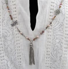 Beautiful Boho-inspired long necklace with gorgeous stainless steel tassel charm!  Necklace measures 32 inches around to the pendant.  The tassel pendant adds another 3 inches.   This necklace can be placed over your head but a lobster clasp is attached for convenience.   This a fun and easy piece to wear. Links are hand-wired with beautiful multi-color glass beads and silver plated charms. Beautiful neutral shades will go with every outfit!  Silver plated dragonfly and rose charms are placed throughout the necklace...nice touch! So many beautiful beads and details! Beads may vary slightly than pictured due to availability.  Great gift for Mother's Day, Christmas or for yourself!  This would also make a great necklace to wear to a boho chic wedding or to the beach! Comes boxed and ready fo Antique Jewelry Victorian, Sweetheart Jewelry, Boho Jewelry Diy, Beaded Dragonfly, Boho Necklaces, Long Necklace Boho, Dragonfly Charm, Chic Necklace, Bridesmaid Bracelet