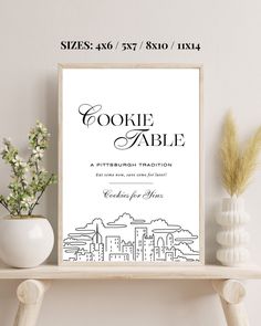 a poster with the words cookie table in black and white on it next to some vases