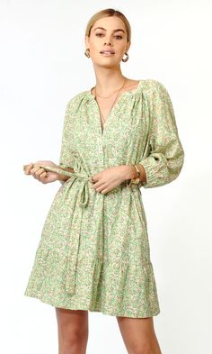 With a waist tie and gathered detail, this fun prairie has a flexible design for multiple occasions and seasons. Rayna is made with a button front accent and elastic hem sleeves. The dress is most notable for it's delicate green floral pattern. Long puff sleeve dress Hidden pockets Button front 3/4" Self collar edge st Long Puff Sleeve Dress, Floral Puff Sleeve Dress, Green Floral Pattern, Puff Sleeve Dress, Edge Stitch, Flexible Design, Puffed Sleeves Dress, Luxury Dress, Long Puff Sleeves