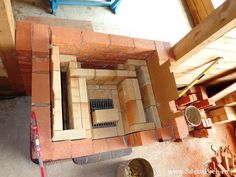 an overhead view of a room with bricks and tools on the floor next to it