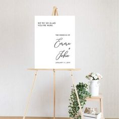 an easel with a sign that says, we're so glad you're here