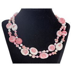 This beautiful double impressive strand of pinky creamy white natural Coral is 17 1/2 inches long. The largest are approximately 19mm x 18mm. They are enhanced by little round pinky creamy white rondels - approximately 6mm - and tiny little color matching Corals and bright pink round crystals. The clasp is an easy to use silver hook clasp. Pink Round, Natural Coral, Coral Necklace, Hook Clasp, Multi Strand Necklace, Color Rosa, Creamy White, Multi Strand, Bright Pink