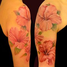 a woman's arm with pink flowers on it