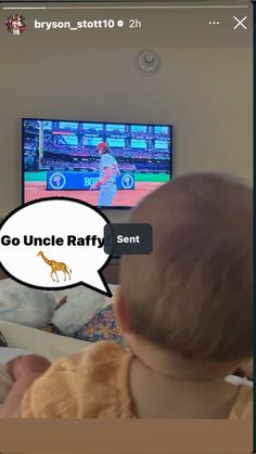 a baby is sitting in front of a television with the caption go uncle raffy sent