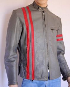 "RARE - Vintage 1970's Men's Leather Cafe Racer Motorcycle Jacket Thick Gray leather with red stripes. Heavy duty zipper and snaps at the neck- very well made. three zippered pockets on the front and zippers on the cuffs of the sleeves. Fully lined. Has that iconic look all you guys are looking for and made by Sears, they were a great brand back then. Condition: Was Professionally Cleaned and conditioned, does have a patina to the leather from age and wear. See pics for all details. Brand: Sears Vintage Red Leather Biker Jacket, Red Vintage Leather Jacket With Long Sleeves, Retro Red Winter Biker Jacket, Red Retro Long Sleeve Biker Jacket, Retro Fitted Red Biker Jacket, Retro Red Fitted Biker Jacket, Racer Motorcycle, Moto Biker Jacket, Cafe Racer Motorcycle