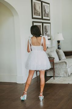 This white textured organza dress is the perfect staple item for any wardrobe. With shoulder tie straps and a flowy skirt, it offers the perfect combination of comfort and style!   100% polyester, lined  Model is 5'6" with a 34" bust, 26" waist, and 35" hips and wearing a small, runs true to size  Size recs: 0-2-S, 4-6-M, 8-L Organza Dress, Flowy Skirt, Tie Dress, Trending Now, White Dress, Skirt, Wardrobe, White