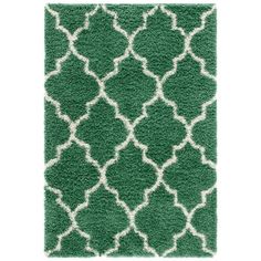 a rug with green and white designs on it