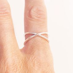 Ring Criss Cross Minimalist in Sterling Silver by Jungle Via View chart in the images to determine your size  Sizes: This ring is adjustable as the ring is not fused together (view images) it is bent to a size 7 but if you like I can adjust it for you. Modern Adjustable Hypoallergenic Stackable Rings, Minimalist Infinity Stackable Rings, Minimalist Adjustable Metal Ring Jewelry, Modern Adjustable Open Band Midi Rings, Adjustable Open Ring Minimalist Style, Adjustable Modern Midi Rings With Simple Design, Minimalist Adjustable Ring Jewelry, Minimalist Adjustable Open Band Ring, Adjustable Minimalist Open Midi Rings