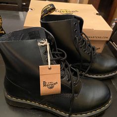 The 1460 Is The Original Dr. Martens Boot. Its Instantly Recognizable Dna Looks Like This: 8 Eyes, Classic Dr. Martens Smooth Leather, Grooved Sides, A Heel-Loop, Yellow Stitching, And A Comfortable, Air-Cushioned Sole. These Are Labeled And Were Advertised As “Silver,” But At A Glance, They Look Black. If You Look Closely, They Appear To Be A Dark Pewter Color With A Slight Metallic Sheen. Classic Black Martin Boots For Winter, Classic Steel Toe Combat Boots For Streetwear, Classic Work Boots With Leather Footbed For Streetwear, Classic Combat Boots With Steel Toe For Streetwear, Classic Black Boots For Streetwear, Classic Black Work Boots For Streetwear, Black Plain Toe Work Boots For Streetwear, Classic Black Martin Boots With Plain Toe, Leather Boots Men